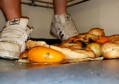 Teen crushing apples barefoot