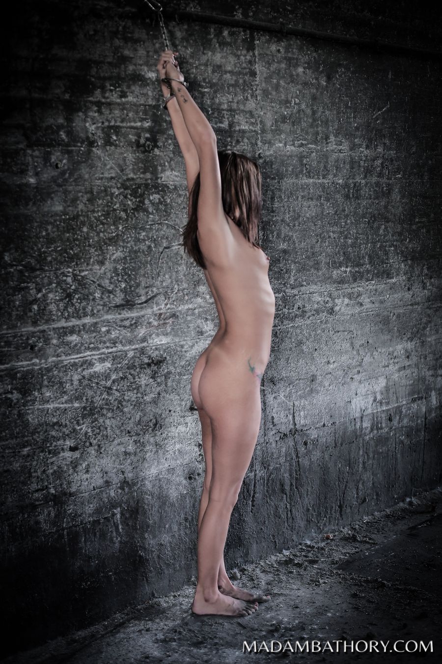 Isabella shackled naked wall