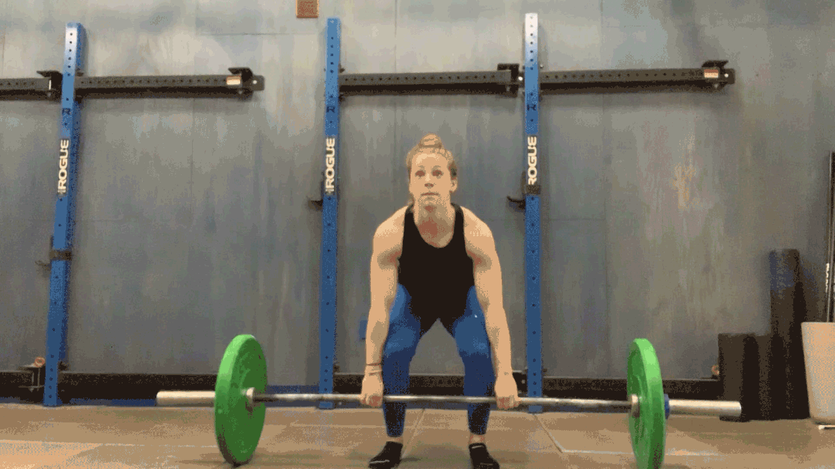 Very strong girl lift holding over